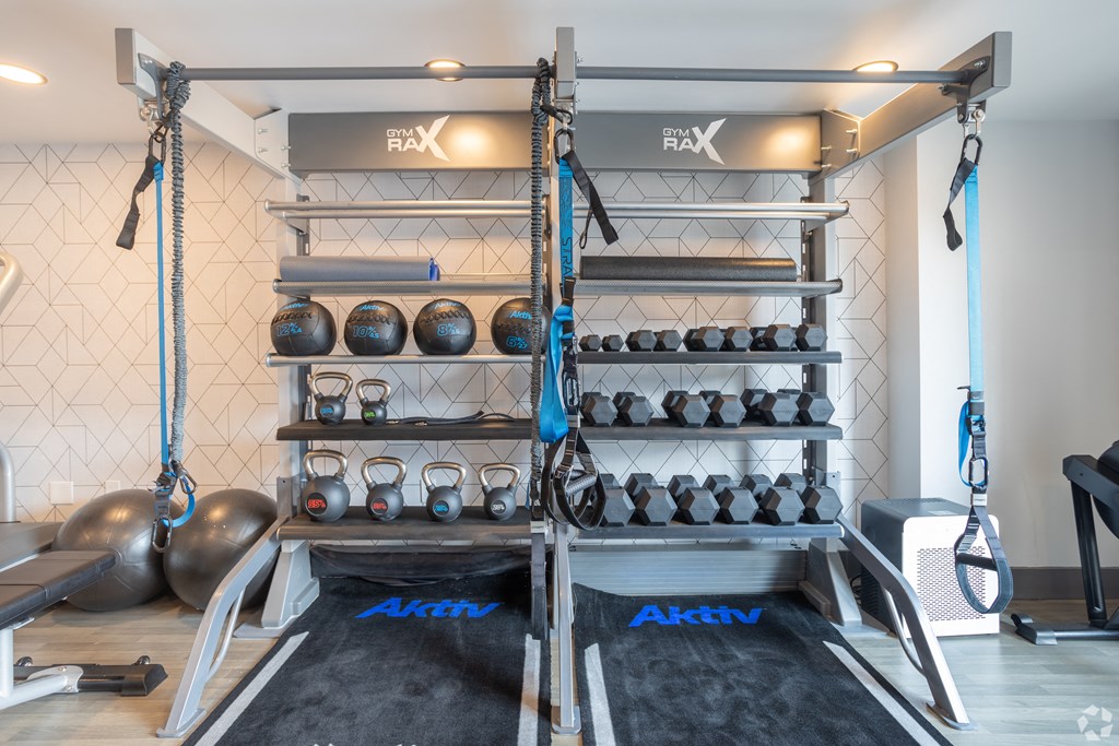 Free Weights In Gym at Latitude at South Portland Apartment, Maine, 04106