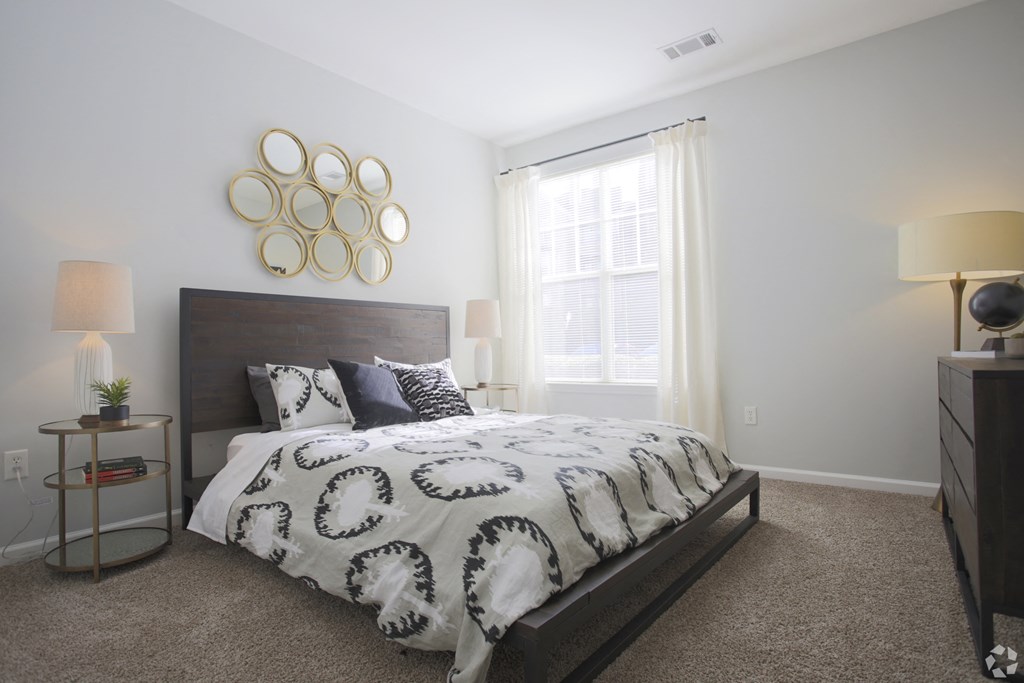 Model bedroom with queen size bed Dakota Mill Creek Buford, GA