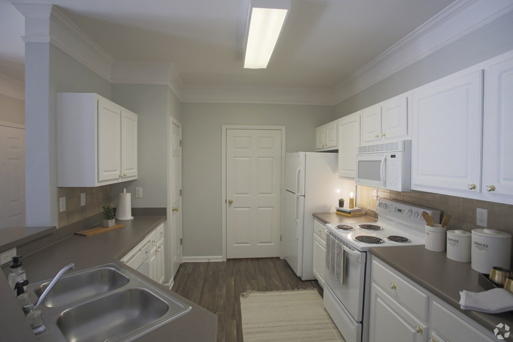 Kitchen with white cabinets and appliances Dakota Mill Creek Buford, GA