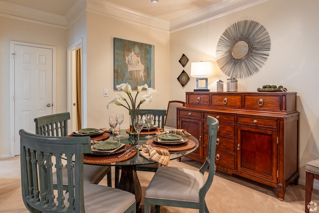 a dining room with a dining table and chairs