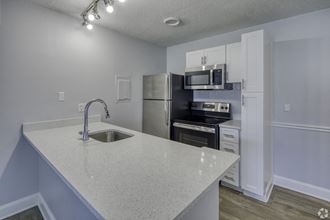 the preserve at ballantyne commons apartment kitchen with stainless steel appliances
