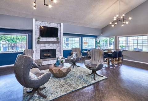 A living room with a fireplace and a television.