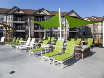 Poolside Sundeck With Relaxing Chairs at Century Belmont Station, Kentucky, 40243 - Photo Gallery 16