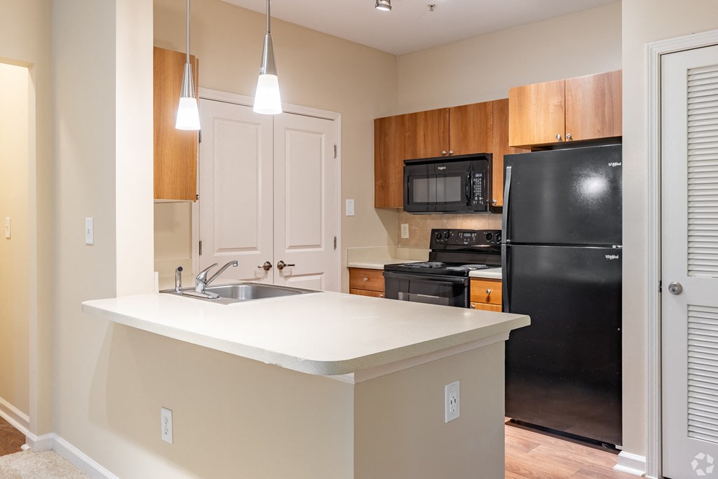 Overlook at Gwinnett Stadium kitchen with bar countertop. Lawrenceville, GA.