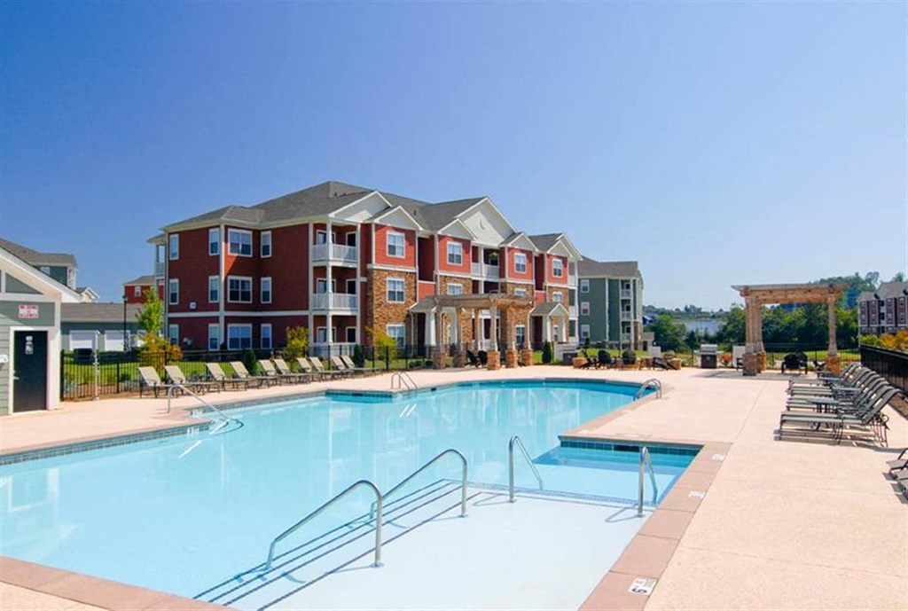 Sparkling pool with sundeck at the Haven at Knob Creek Apartments Johnson City, TN