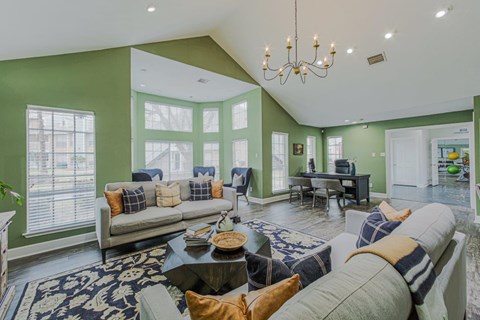 A living room with a grey couch and a coffee table.