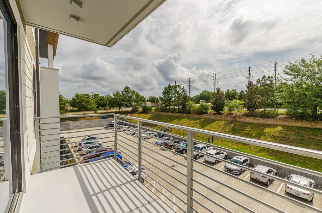 the preserve at ballantyne commons balcony view of cars parked in a parking lot at Lofts at South Lake, Clermont, FL, 34711
