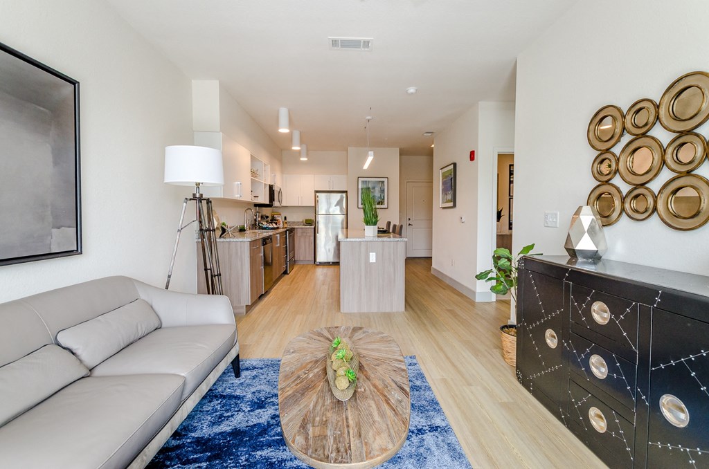 a living room with a couch and a coffee table at Lofts at South Lake, Clermont, 34711