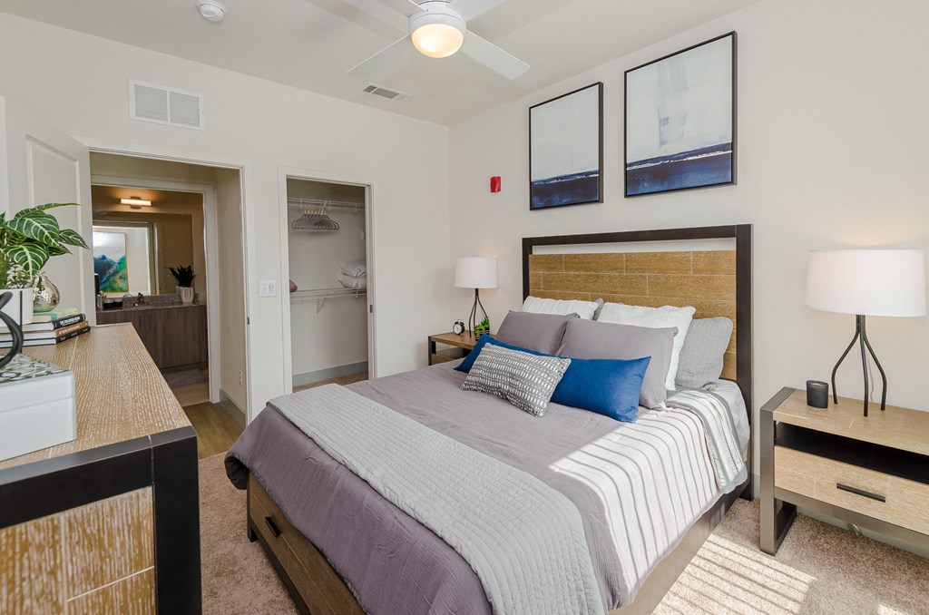 a bedroom with a large bed and a view of a bathroom at Lofts at South Lake, Clermont, FL