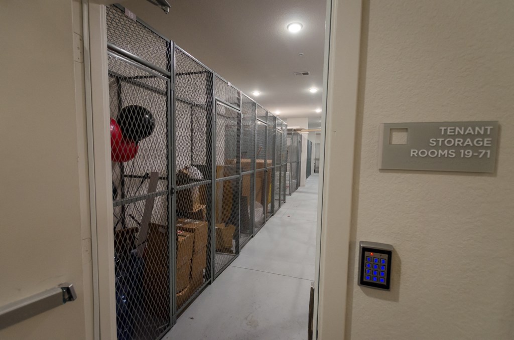a hallway with rows of kennels and a door to a room with a at Lofts at South Lake, Florida