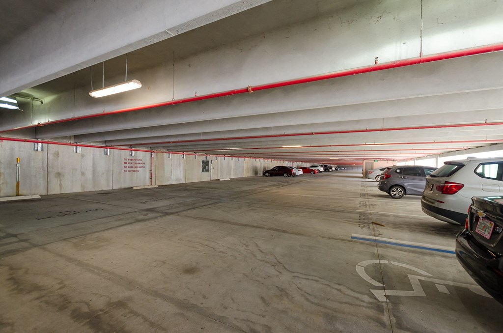 an empty parking garage with cars parked in it at Lofts at South Lake, Clermont, FL