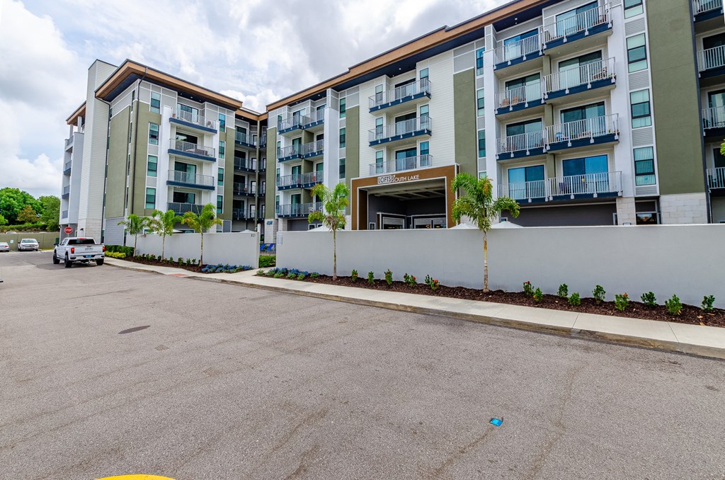an empty parking lot in front of an apartment building at Lofts at South Lake, Florida