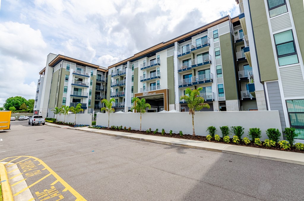 an empty parking lot in front of an apartment building at Lofts at South Lake, Clermont, 34711