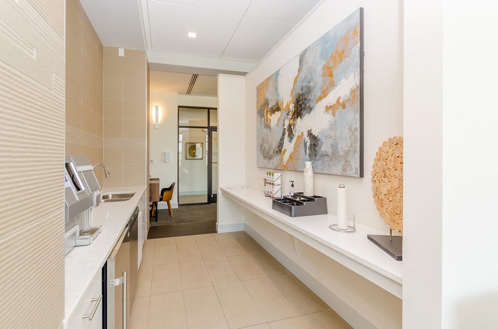 a kitchen with a sink and a painting on the wall at Lofts at South Lake, Clermont