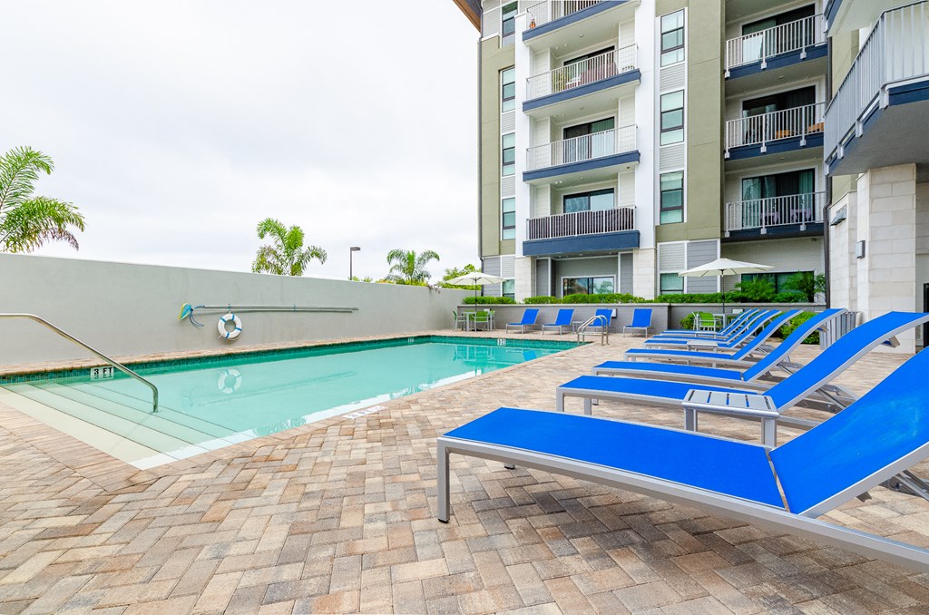 Pool And Relaxing Chairs at Lofts at South Lake, Clermont, FL