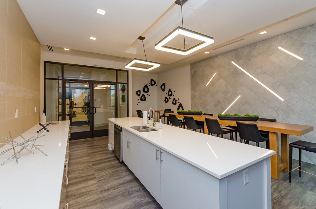 a kitchen and dining area in a modern office building at Lofts at South Lake, Florida