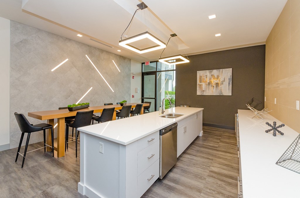 a kitchen and dining area in an office with a table and chairs at Lofts at South Lake, Florida, 34711