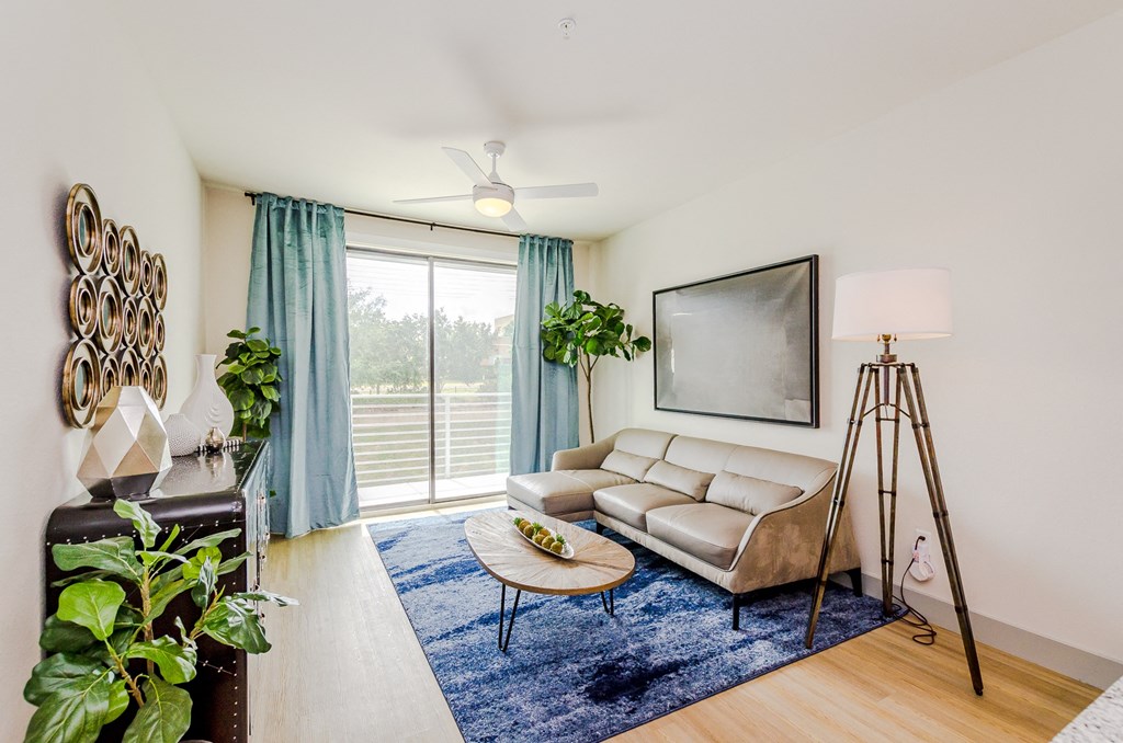 a living room with a couch and a tv at Lofts at South Lake, Clermont, FL, 34711