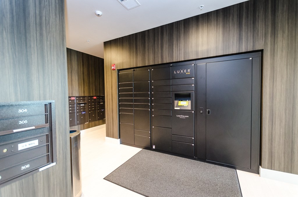 a large set of lockers in a room with a closet and a dresser at Lofts at South Lake, Clermont, FL