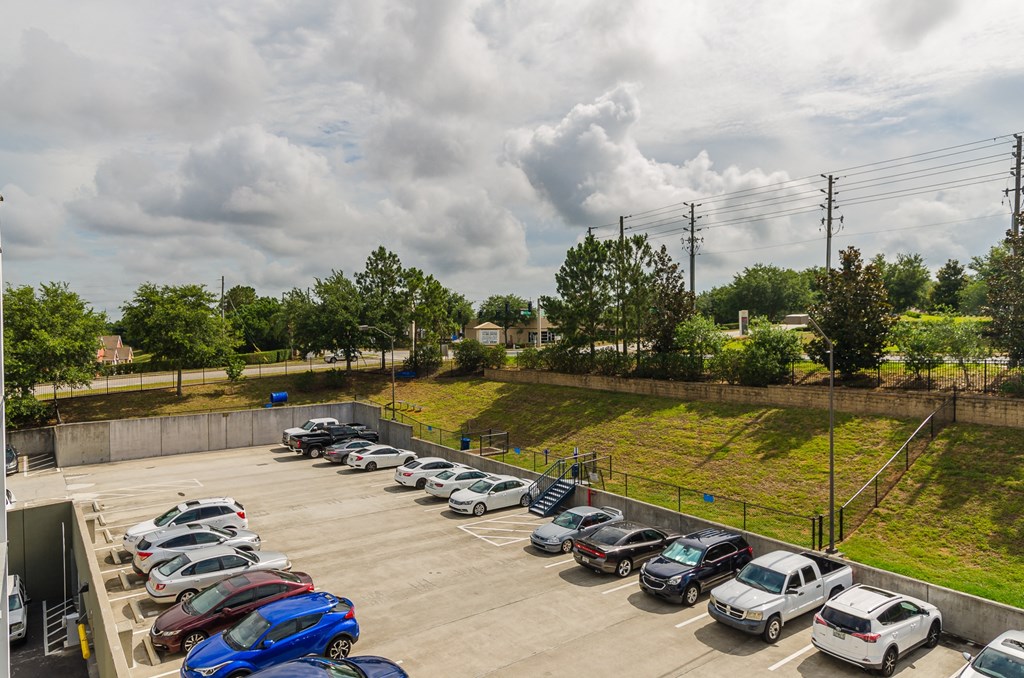 the parking lot of a car dealership with many cars parked at Lofts at South Lake, Clermont, FL, 34711