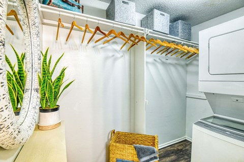 A small laundry room with a washer and dryer.