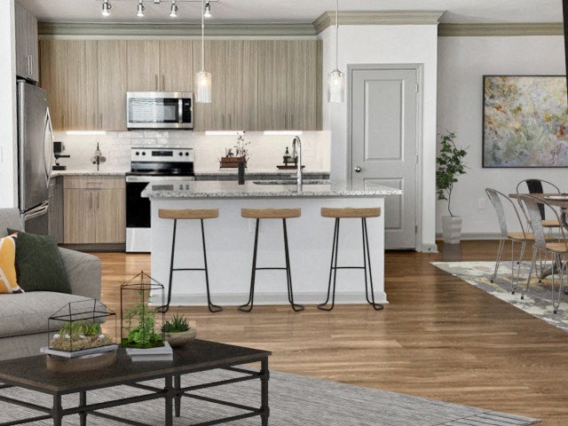 a kitchen and living room with an island with bar stools