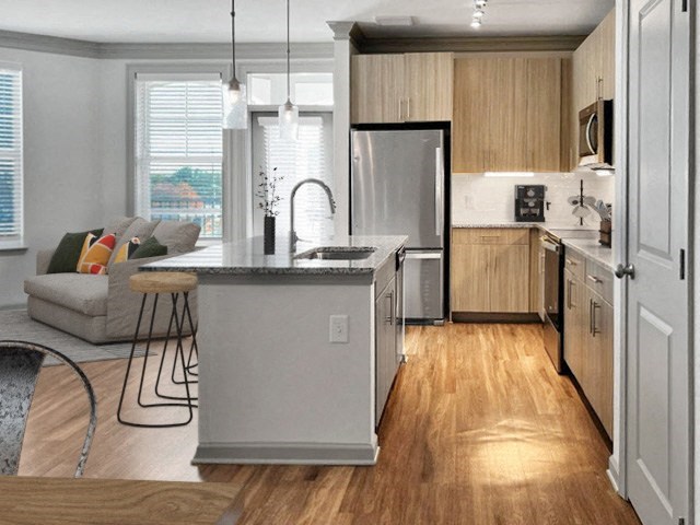 a kitchen with a large island in the middle of it