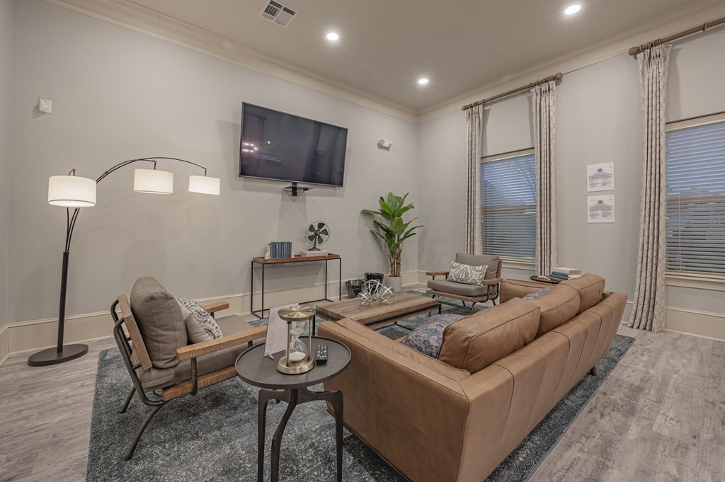 a living room with couches and a tv at Century HomePlace, Alabama, 36066