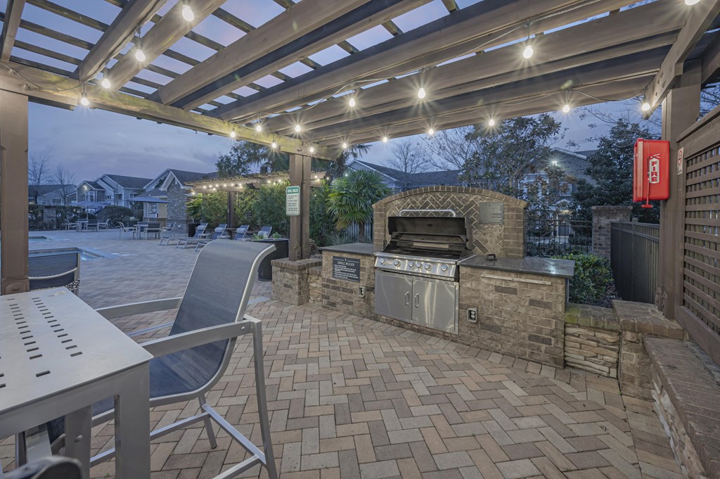 a patio with a grill and a table and chairs at Century HomePlace, Prattville, 36066