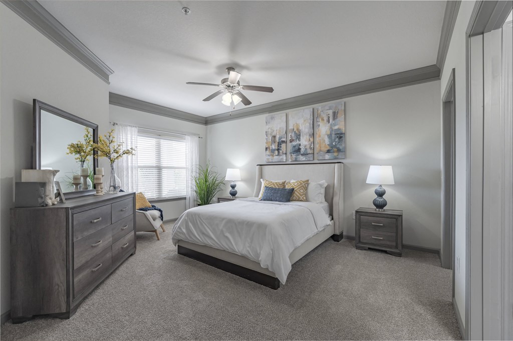 a bedroom with a bed and a ceiling fan at Century HomePlace, Prattville Alabama