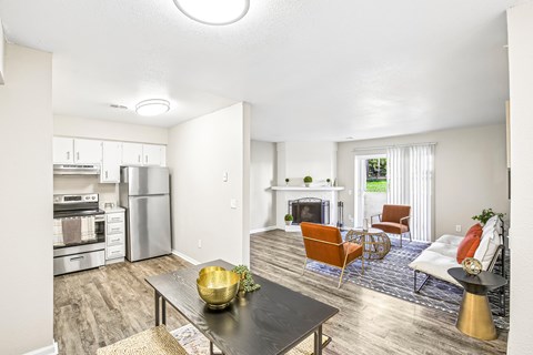 A modern kitchen with a dining table and chairs.