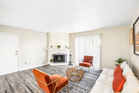 A living room with a fireplace and a chair.
