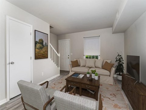 a living room with a couch and a table