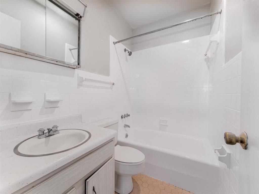 a bathroom with a sink and a shower and a toilet at Four Seasons Villas, Greensboro North Carolina