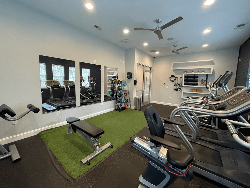 Fitness center with free weights at Oasis at Cedar Branch in Wilmington, NC