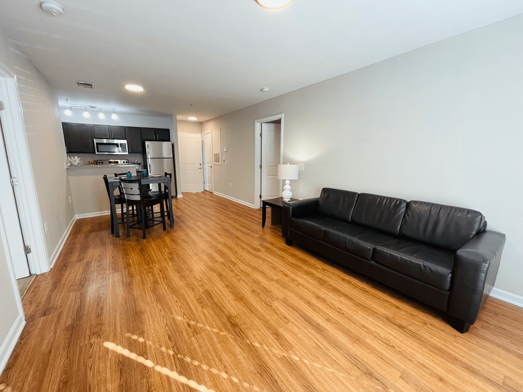 Two-bedroom living room at Oasis at Cedar Branch in Wilmington, NC