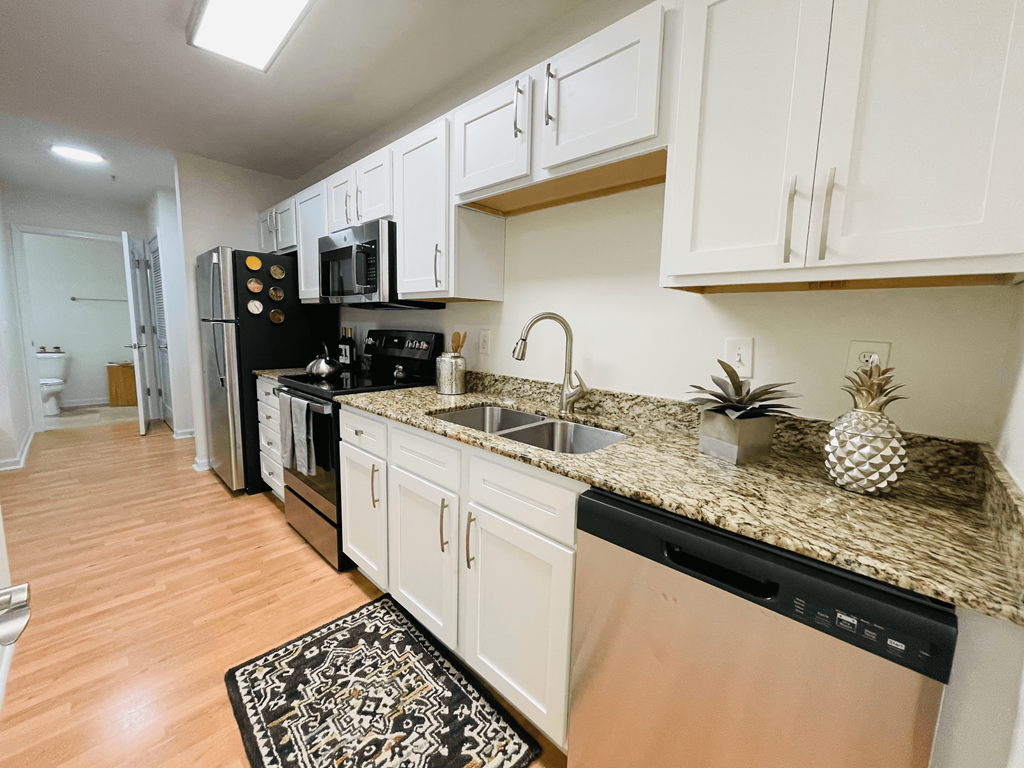 Kitchen with granite counters at Oasis at Twinwood in Wilmington, NC