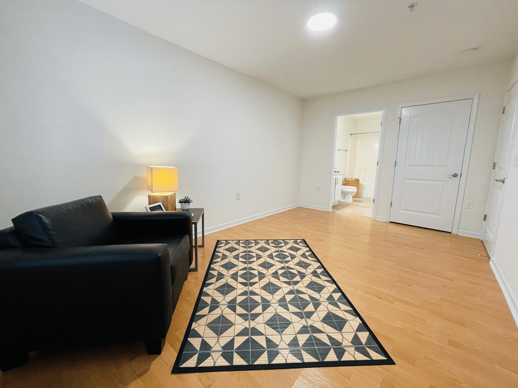 Bedroom with hardwood floor at Oasis at Twinwood in Wilmington, NC