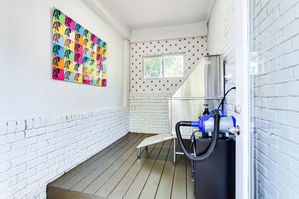 a room with a water heater and a painting on the wall  at The Oasis on Cascade, Atlanta, GA