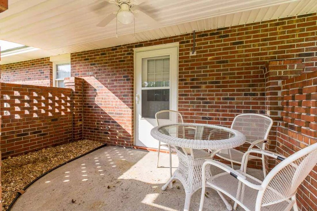 A patio with a table and chairs is shown.