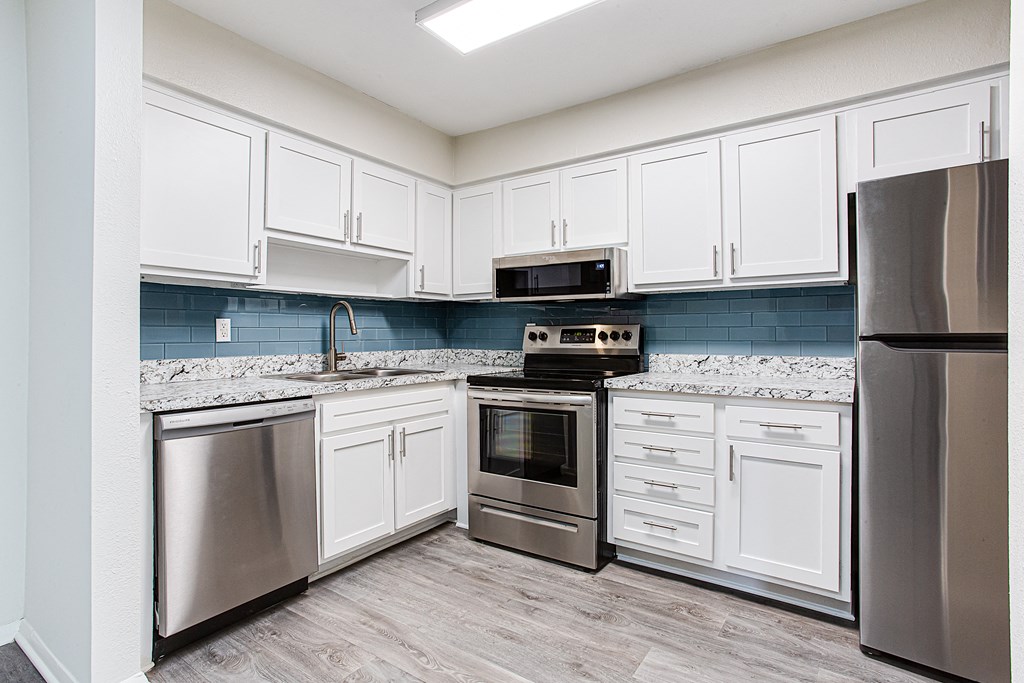 Kitchen with appliances and cabinets at Parks At Utoy Creek, Georgia, 30331