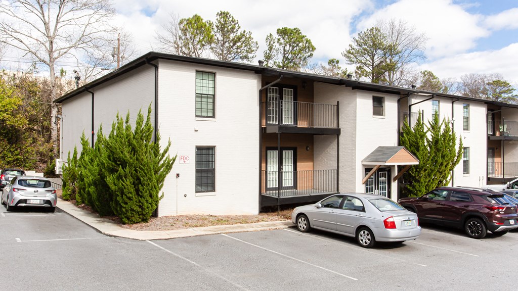 Exterior photo of parking lot and apartments Exterior photo of parking lot and apartments at Parkside Sandy Springs Atlanta, GA