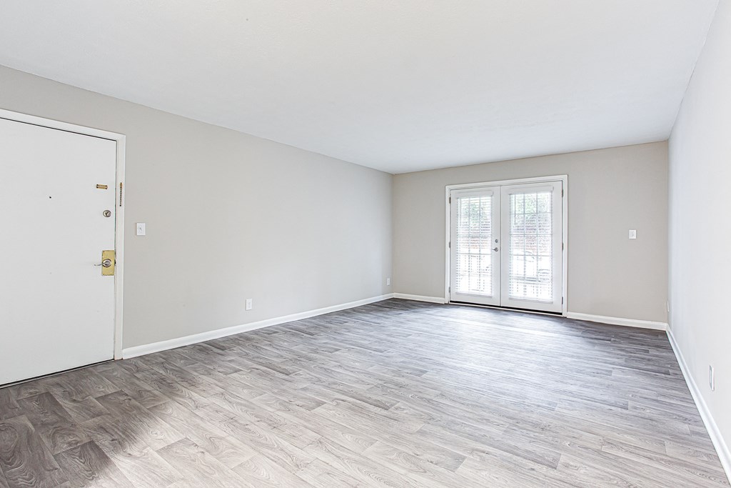 Spacious living room with natural lighting Spacious living room with natural lighting at Parkside at Sandy Springs Atlanta, GA