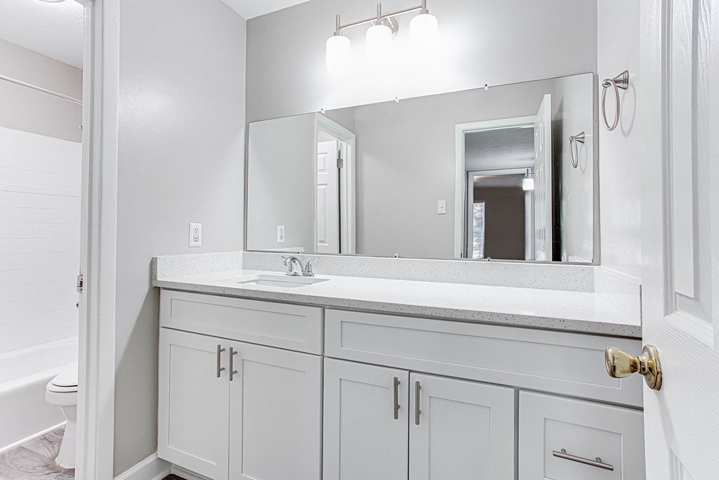 Bathroom with large mirror and storage Bathroom with large mirror and storage at Parkside at Sandy Springs Atlanta, GA