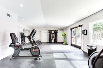 Spacious fitness center with large windows at Parkside at Sandy Springs Atlanta, GA - Photo Gallery 5
