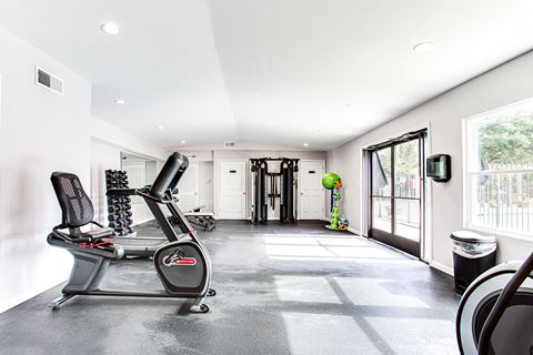 Spacious fitness center with large windows at Parkside at Sandy Springs Atlanta, GA