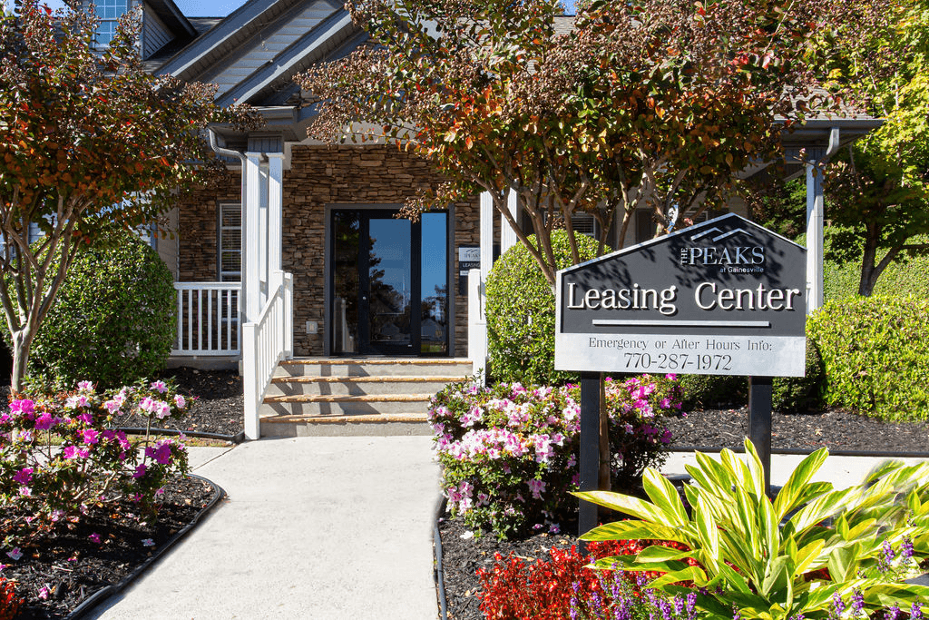 a leasing center sign in front of a building  at Peaks at Gainesville, Gainesville, Georgia