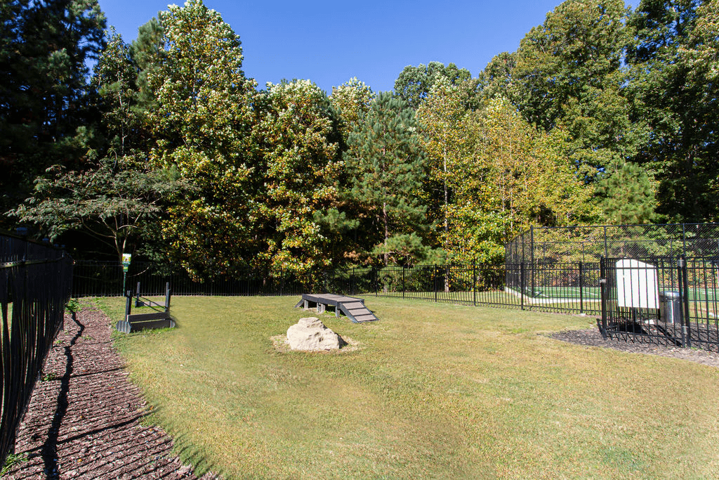 a fenced in area with a picnic table and a bench  at Peaks at Gainesville, Gainesville, GA, 30507