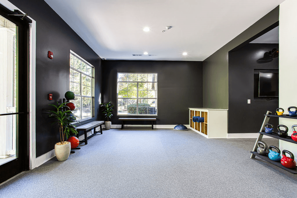 a yoga room with a large window and black walls  at Peaks at Gainesville, Gainesville, Georgia