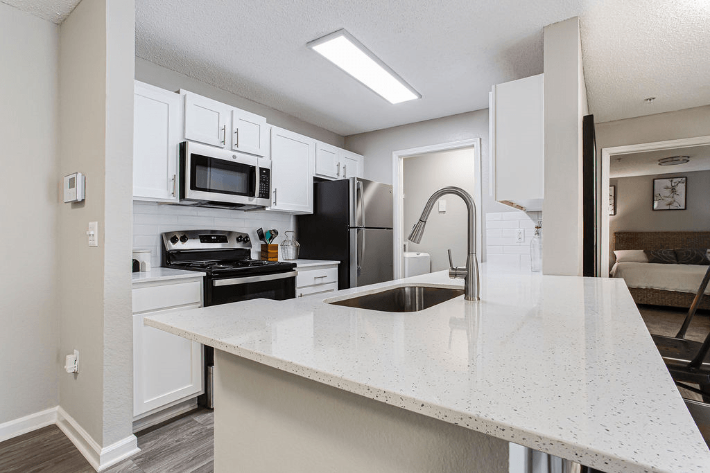 a kitchen with a counter top and a sink  at Peaks at Gainesville, Gainesville, Georgia